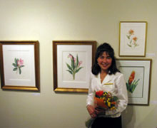 Opening Night & Artist Reception: Victoria to the right of her pieces: “Rhododendron” & “Pink Calla Lily”
